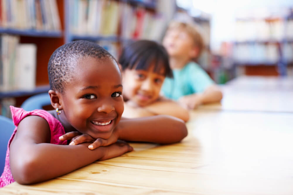 Smiling children in the library